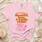 Pink t-shirt with "Bride of Frankenstein, Beautiful, busy, & barely stable." text and graphic.