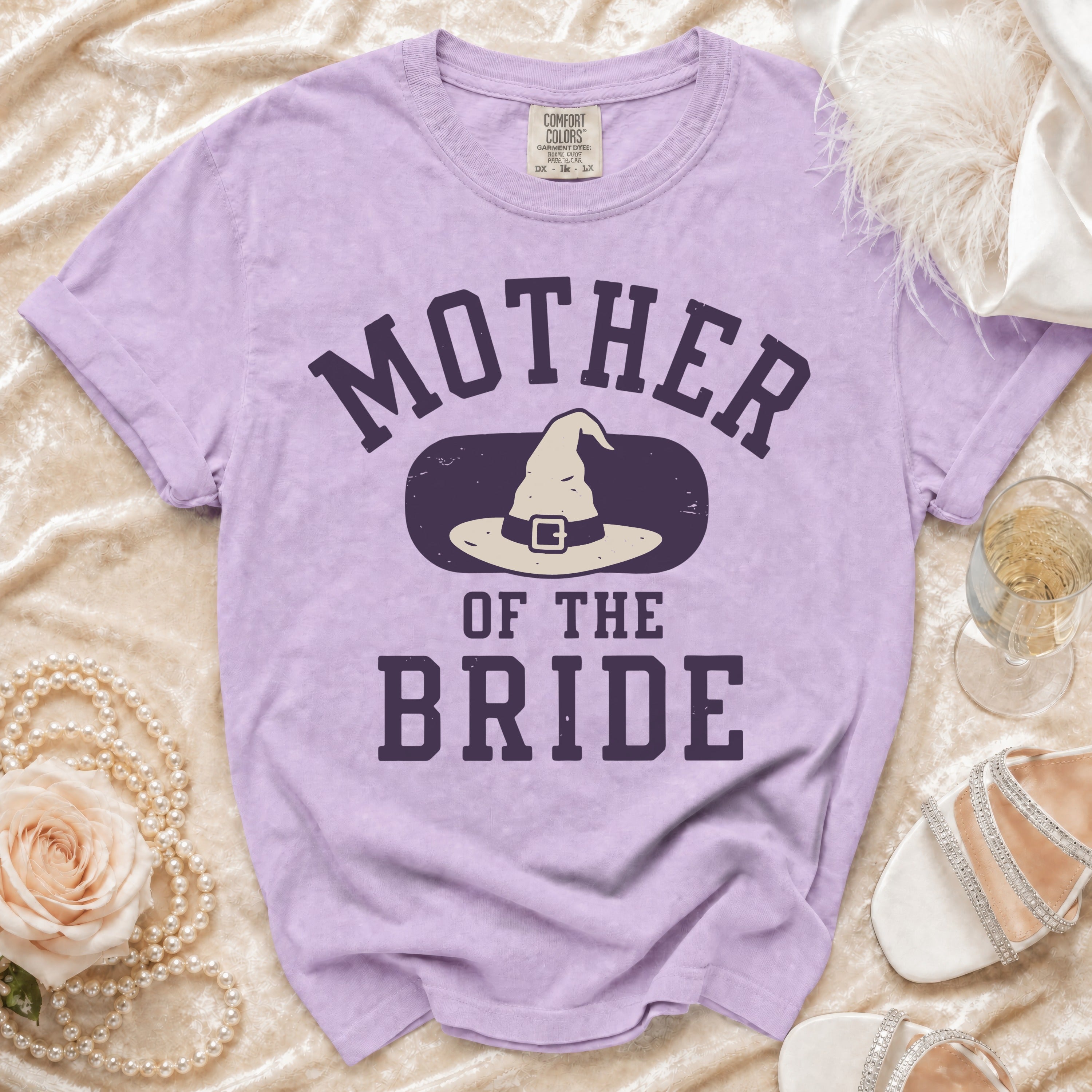 Purple t-shirt with "Mother of the Bride" and witch hat graphic.