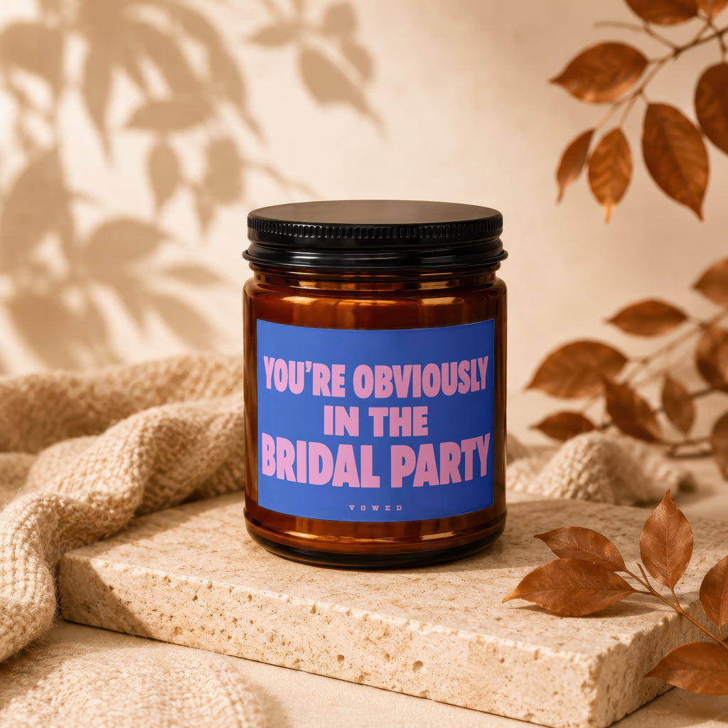Amber candle with "You're Obviously In The Bridal Party" text on a blue label.