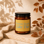 Amber jar candle with yellow label reading "Forever Smells Like This" and "vowed".
