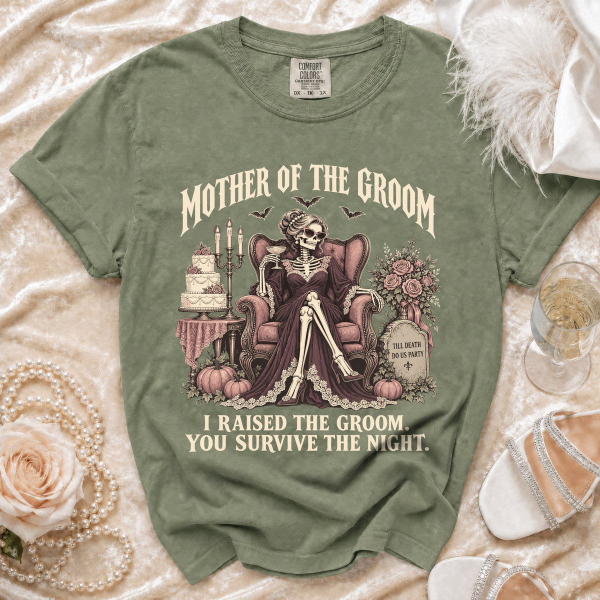 T-shirt with "Mother of the Groom, I Raised the Groom" graphic featuring a skeleton bride.