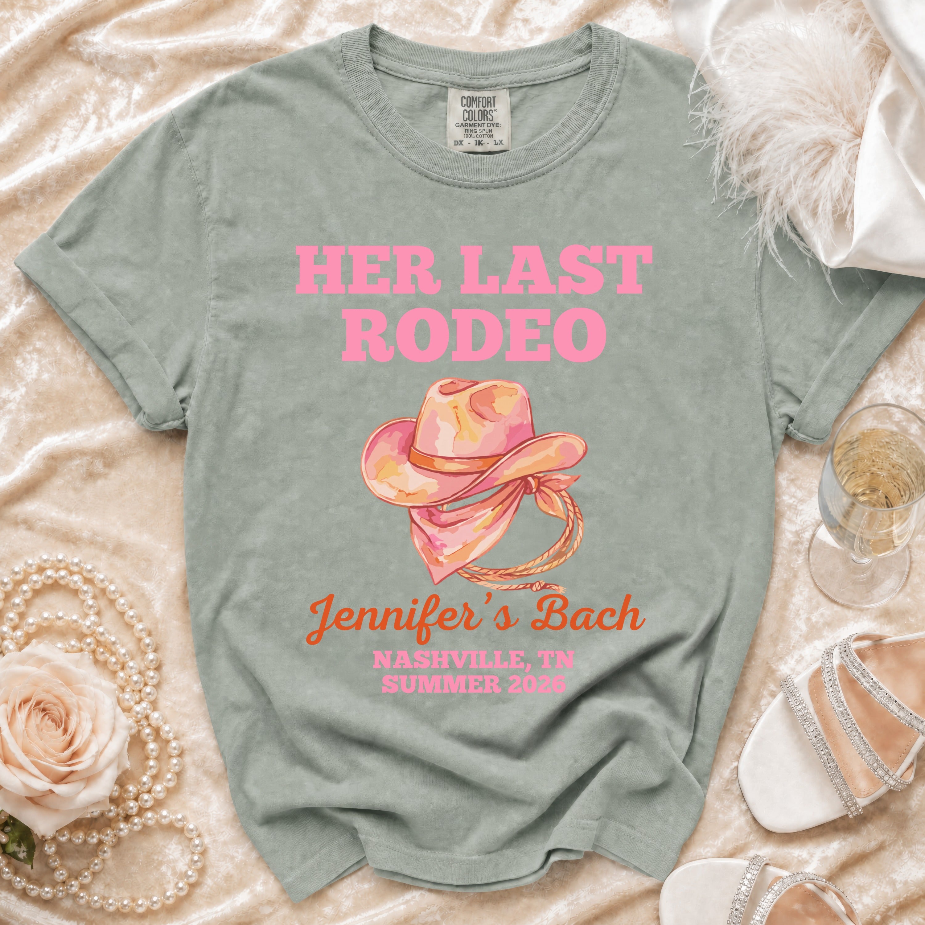 Pink text "HER LAST RODEO" and "Jennifer's Bach Nashville, TN Summer 2026" on a gray t-shirt.