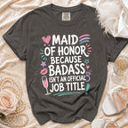 Dark grey t-shirt with "Maid of Honor Because Badass Isn't An Official Job Title" graphic.