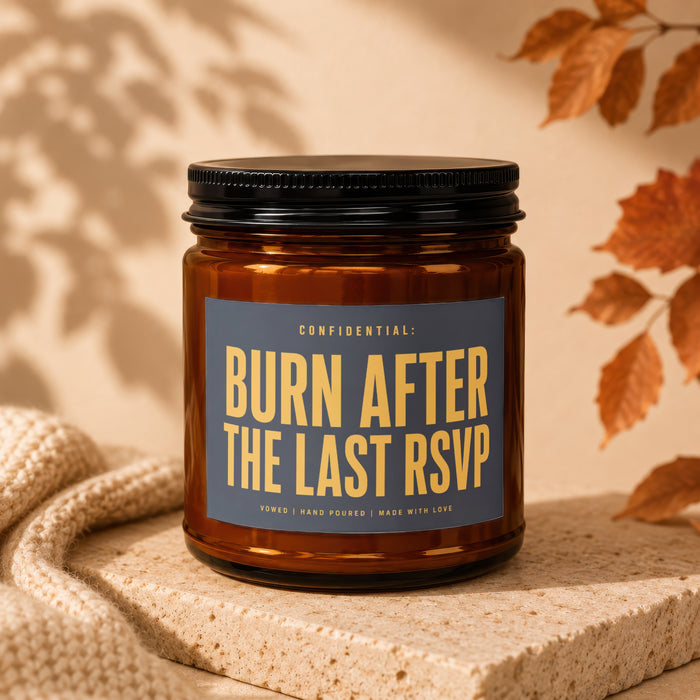 Amber glass candle with dark lid, labeled "CONFIDENTIAL: BURN AFTER THE LAST RSVP".