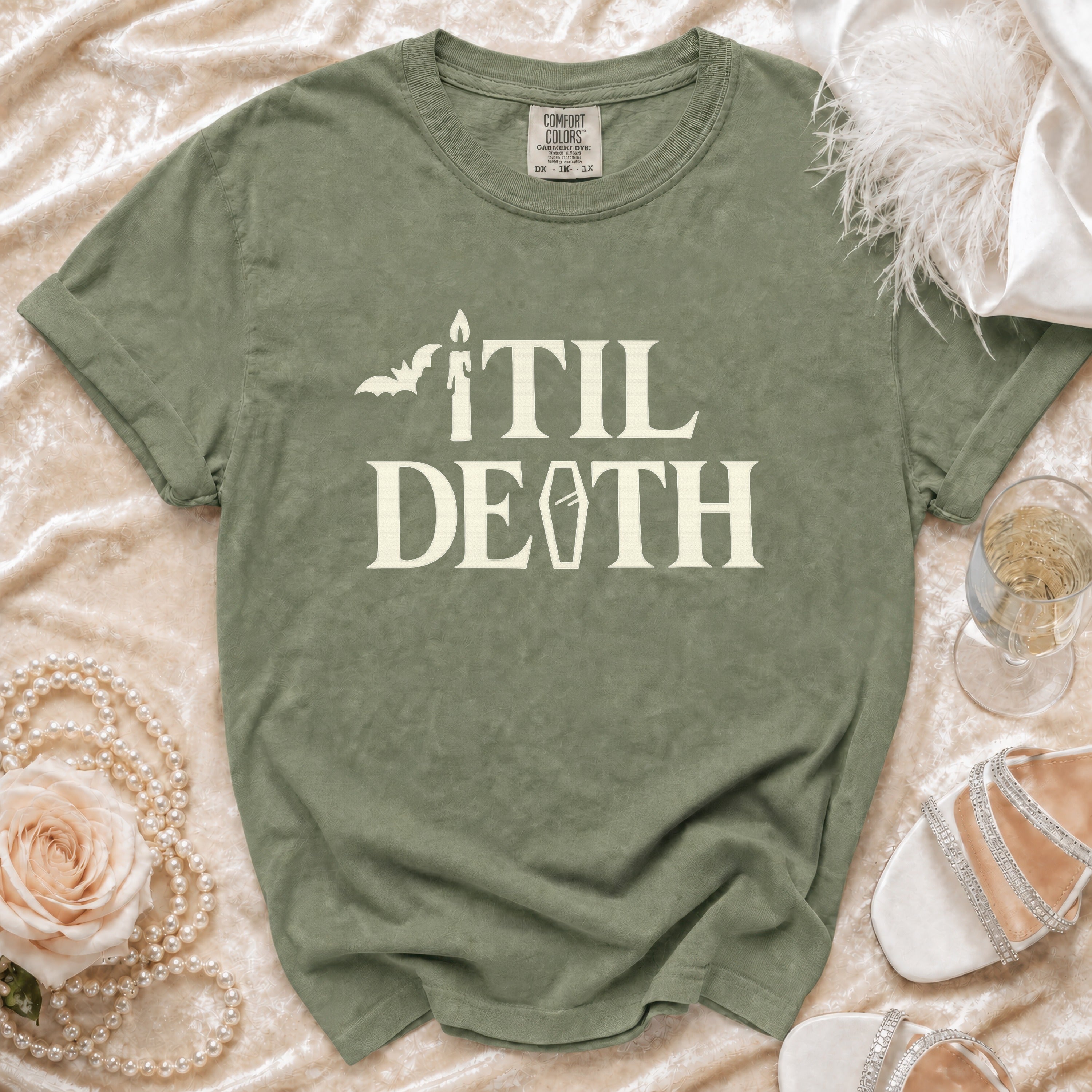 Green t-shirt with "TIL DEATH" text, bat, coffin, and candle graphic.