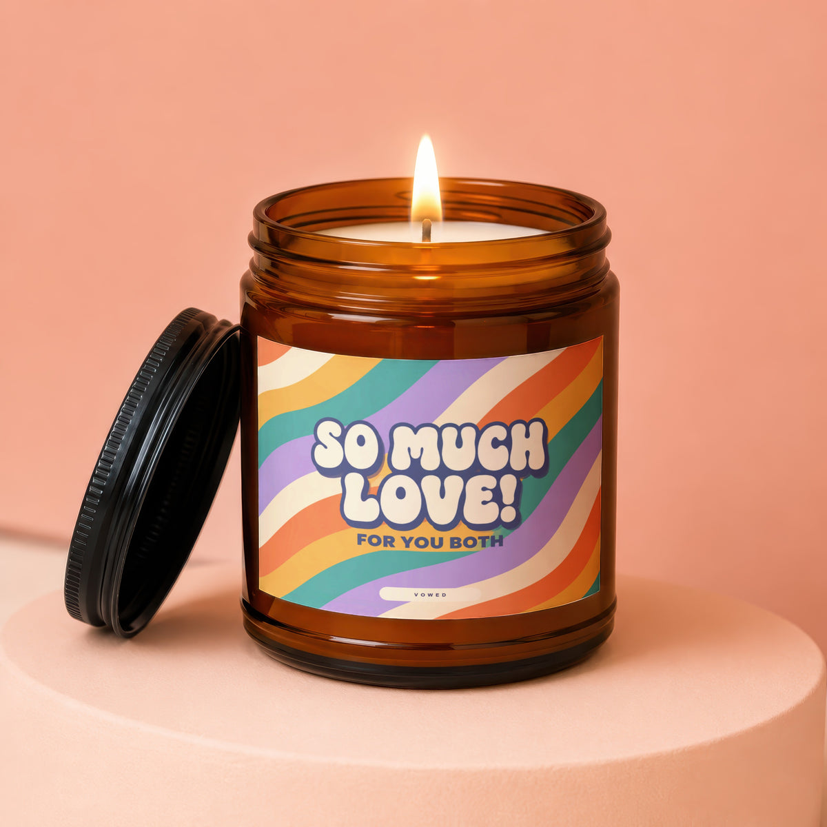 Amber glass candle with "So Much Love! For You Both" text and a lit wick.
