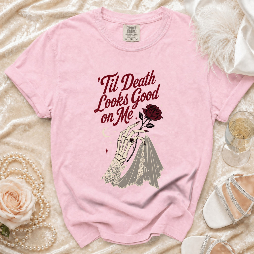 Pink t-shirt with text 'Til Death Looks Good on Me and skeleton hand holding rose.