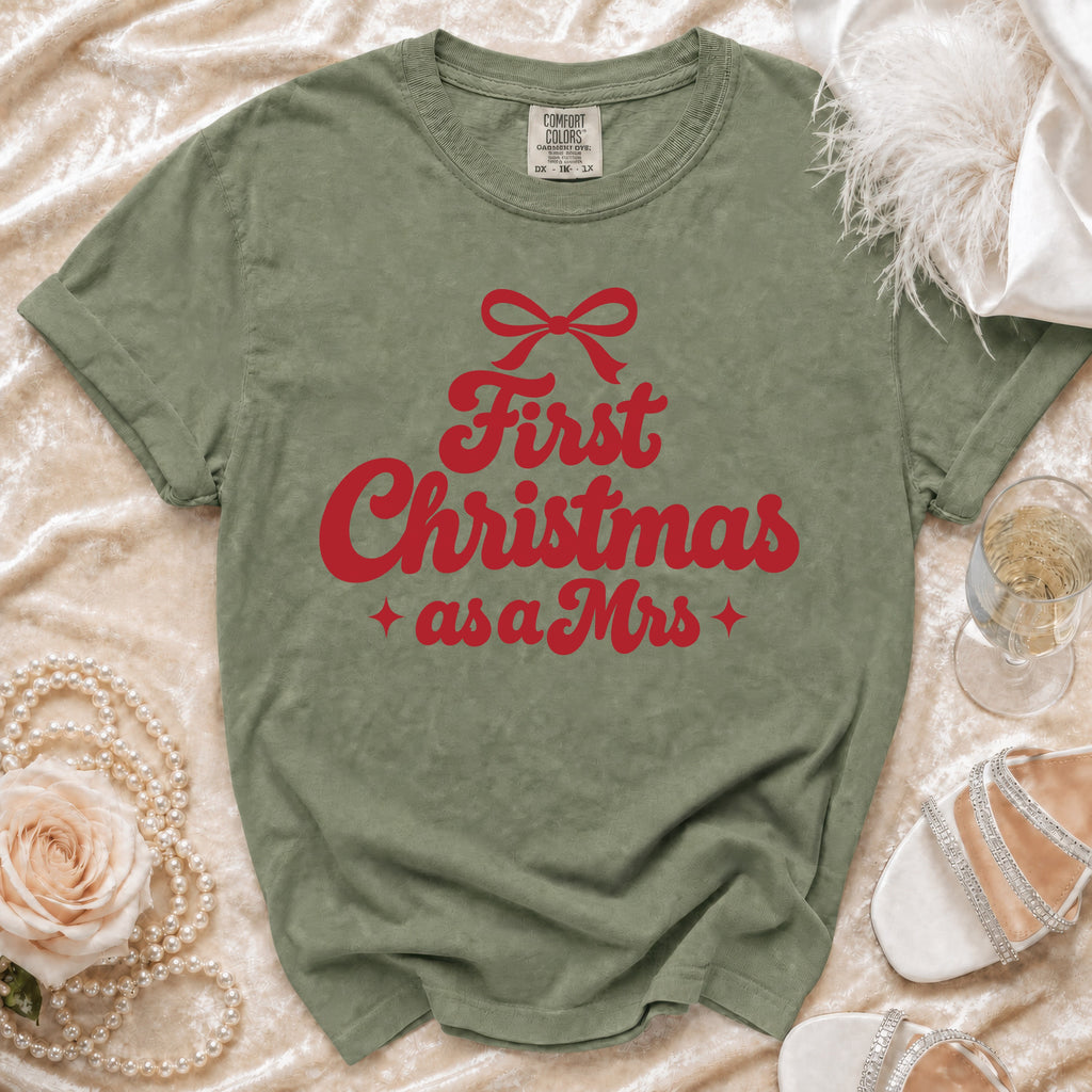 Green t-shirt with red text "First Christmas as a Mrs." and a bow.