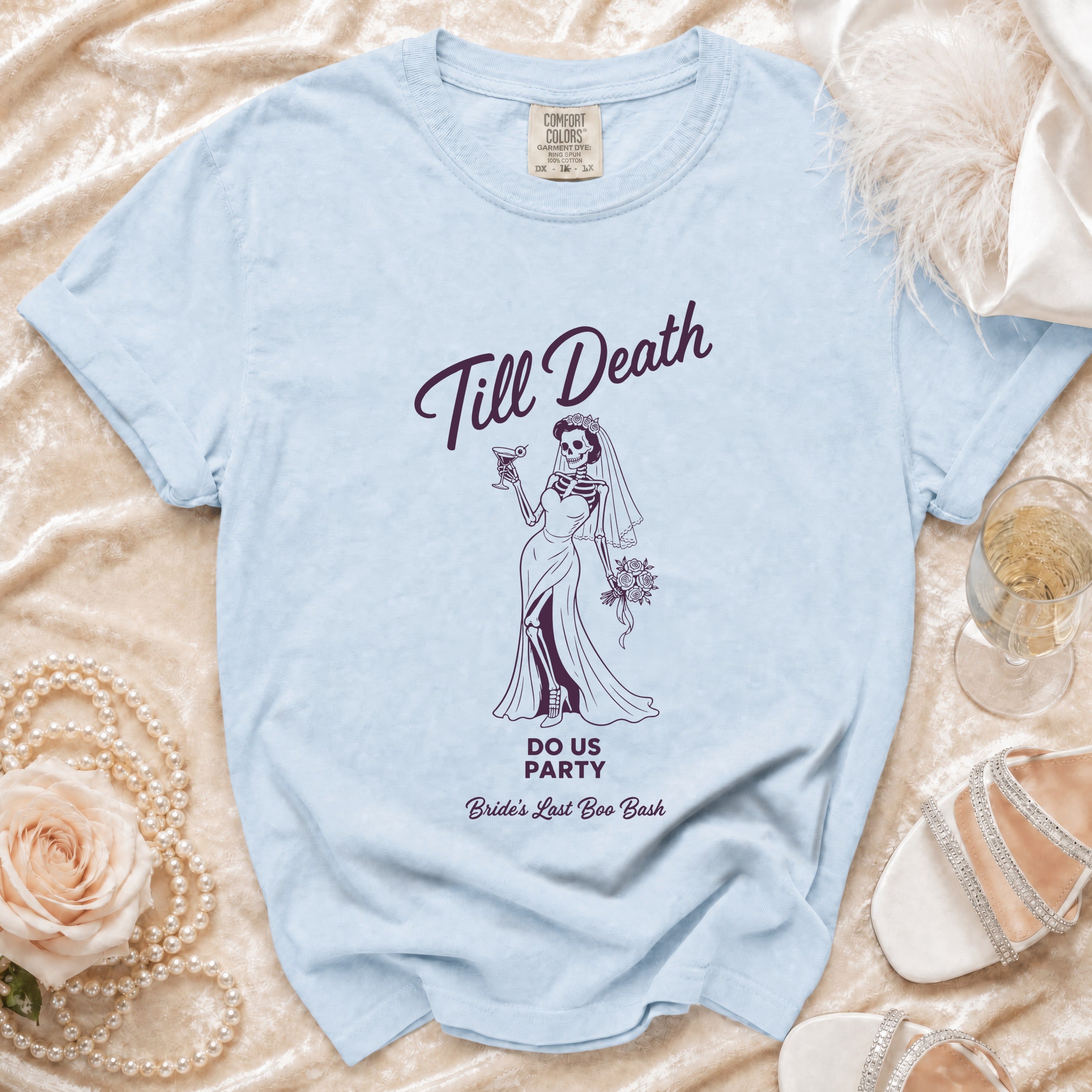 Light blue t-shirt with skeleton bride graphic and text "Till Death Do Us Party Bride's Last Boo Bash".