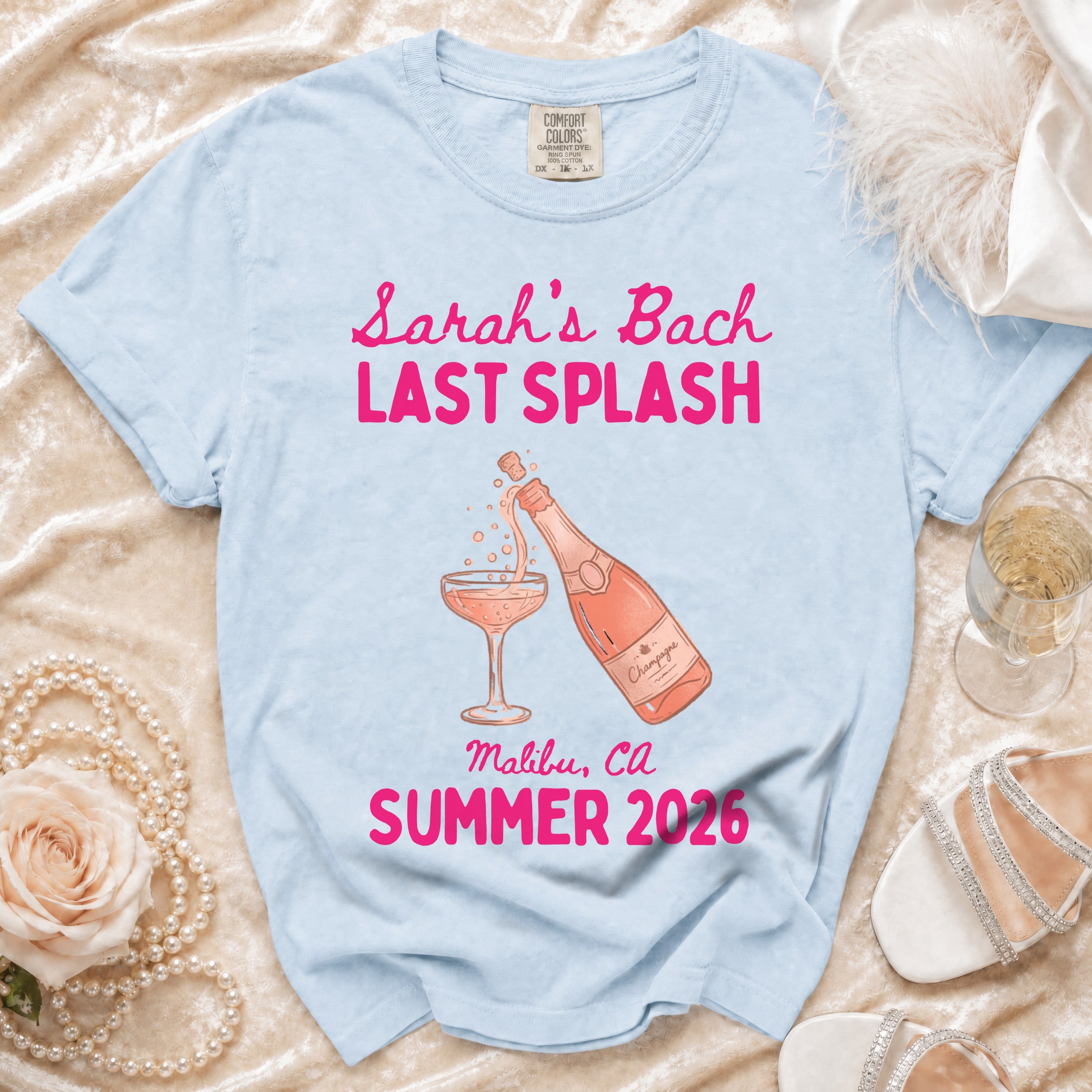 Light blue t-shirt with "Sarah's Bach Last Splash" and champagne graphic.