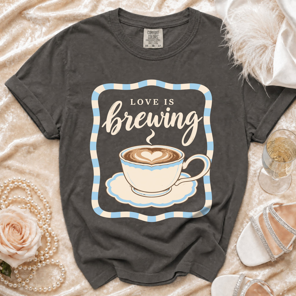 Dark grey t-shirt with "Love is brewing" and coffee cup graphic.