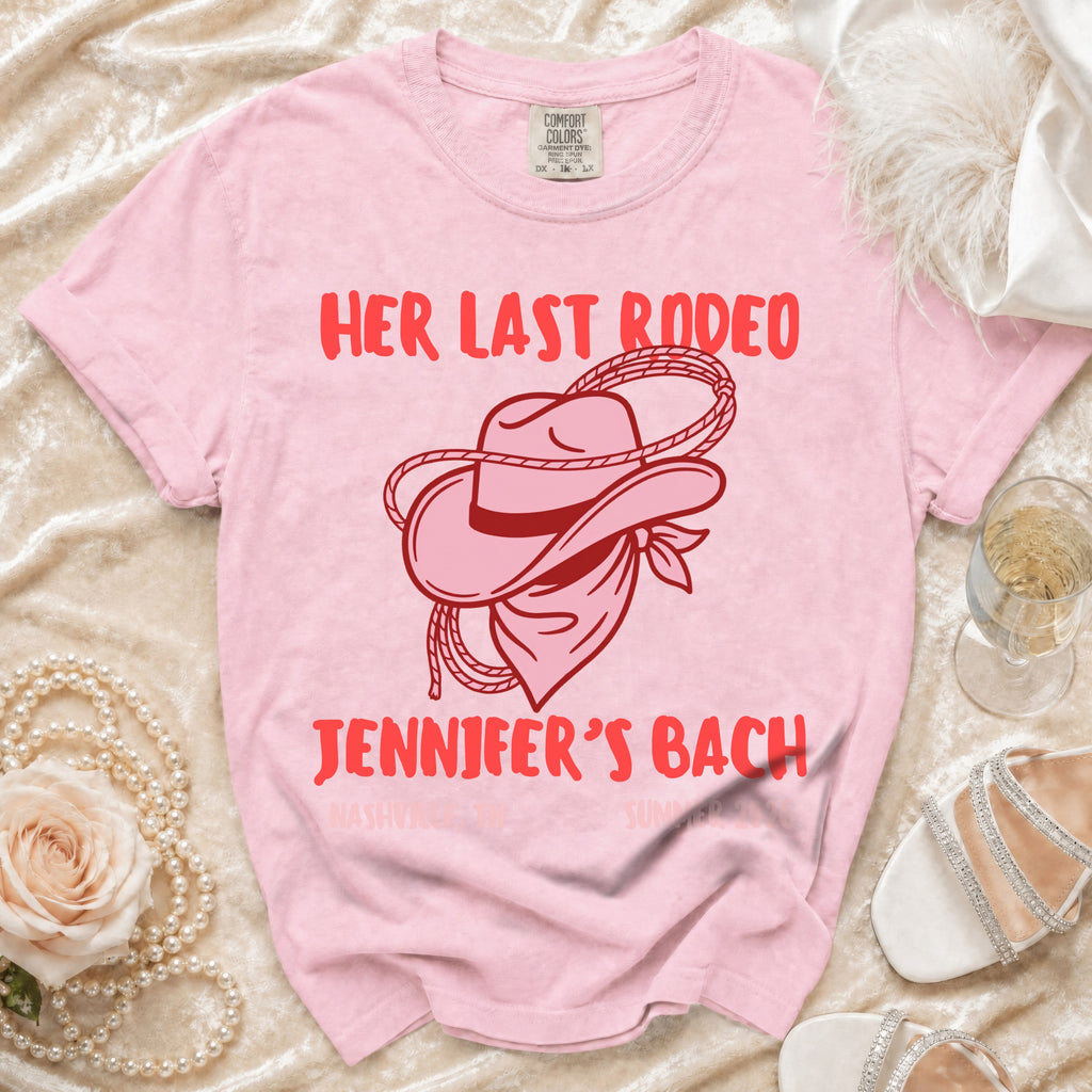 Pink t-shirt with "Her Last Rodeo" and "Jennifer's Bach" text, cowboy hat graphic.