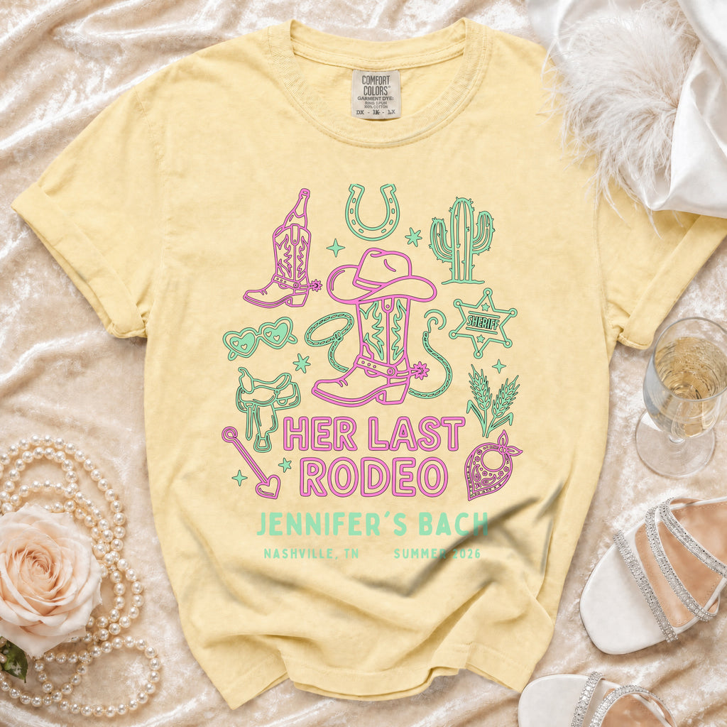 T-shirt with cowboy boots, cactus, and sheriff badge graphic.