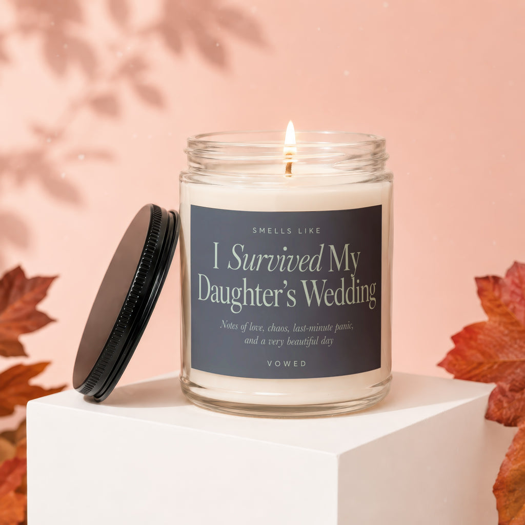 Candle that says "I Survived My Daughter's Wedding" with scent notes.