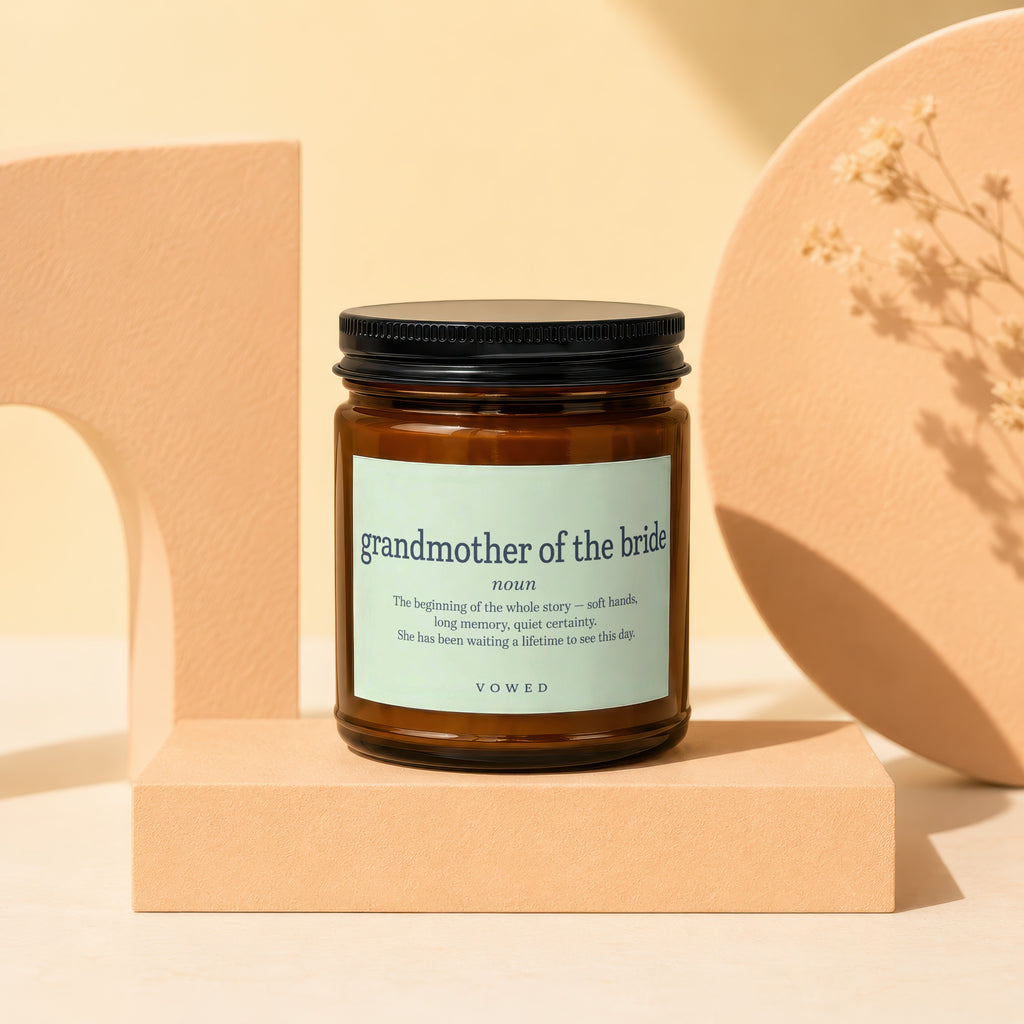 Amber candle with "grandmother of the bride" definition on label.