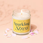 Candle with lid, yellow label reads "Smells like Sparkling Stress Vowed".