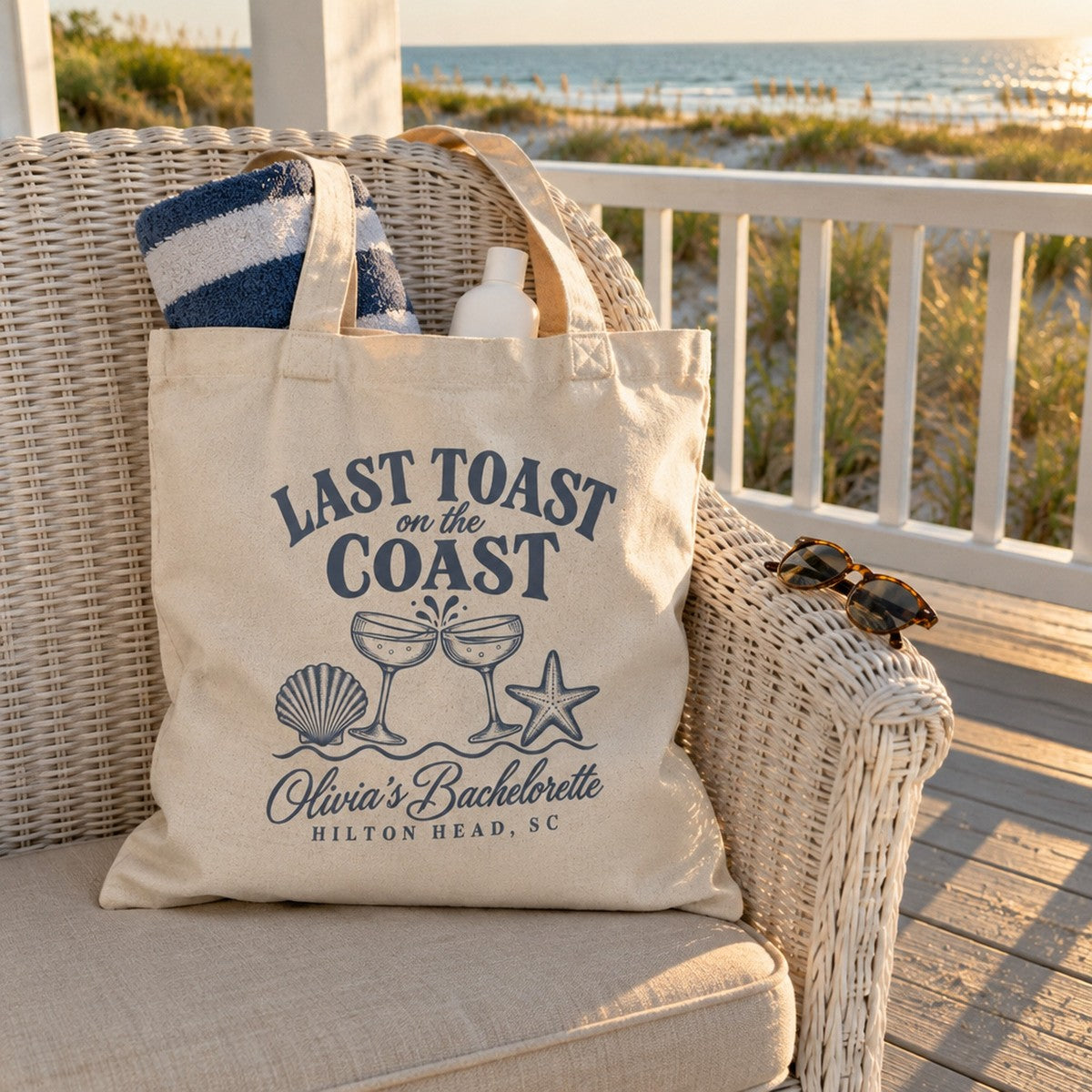 Last Toast On The Coast canvas tote with a beach towel on a porch chair