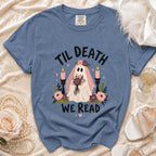 Blue t-shirt with ghost graphic saying "Til Death We Read" and floral accents.