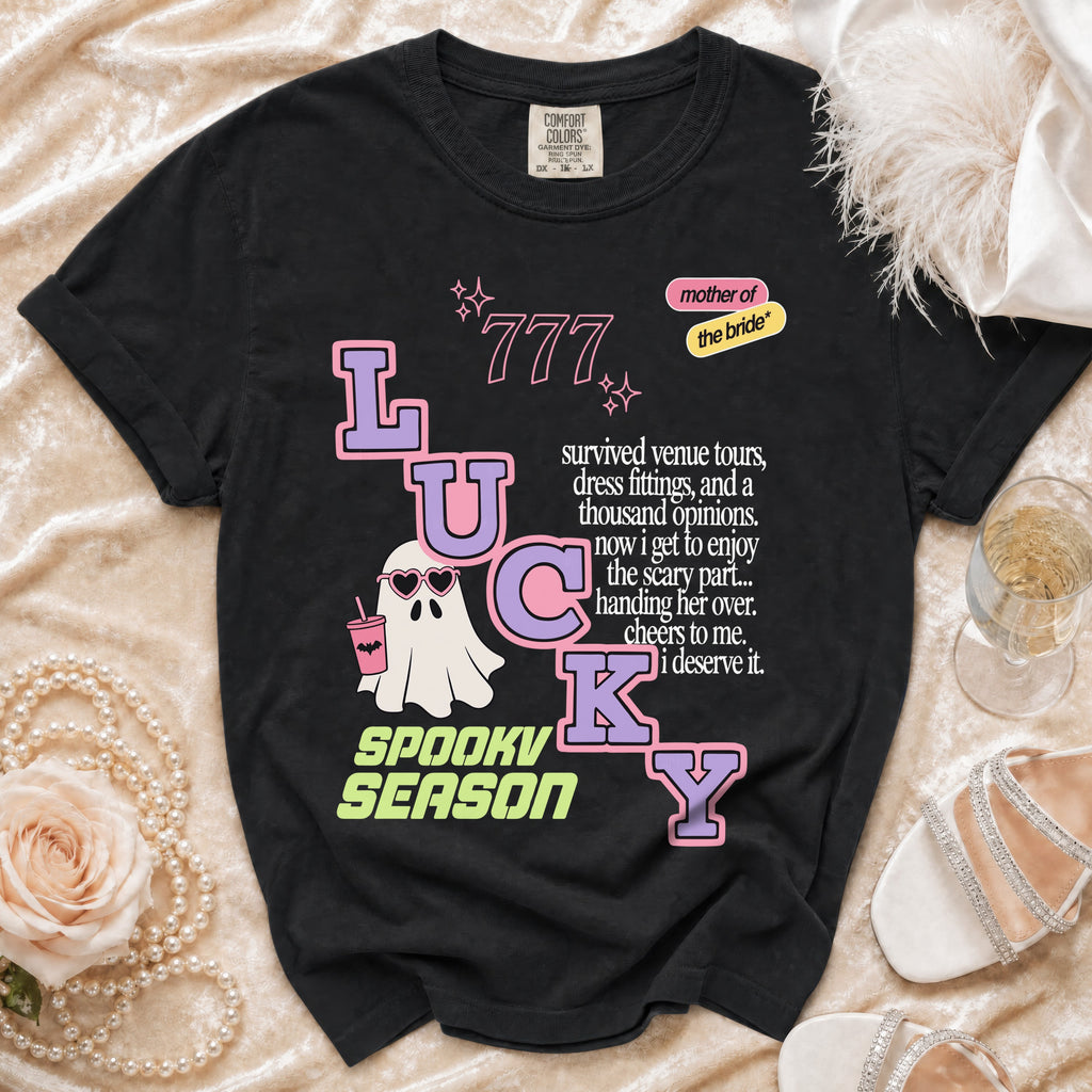 Black t-shirt with "LUCKY SPOOKY SEASON" text, a ghost, and "mother of the bride" graphic.