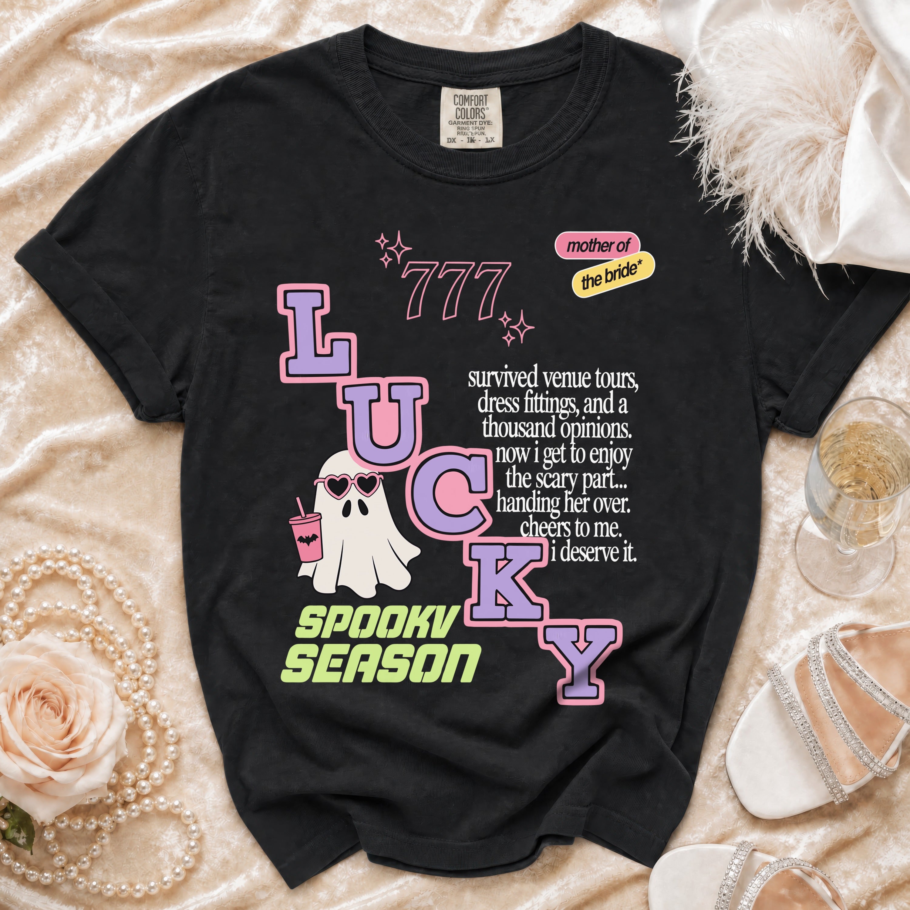 Black t-shirt with "LUCKY SPOOKY SEASON" text, a ghost, and "mother of the bride" graphic.