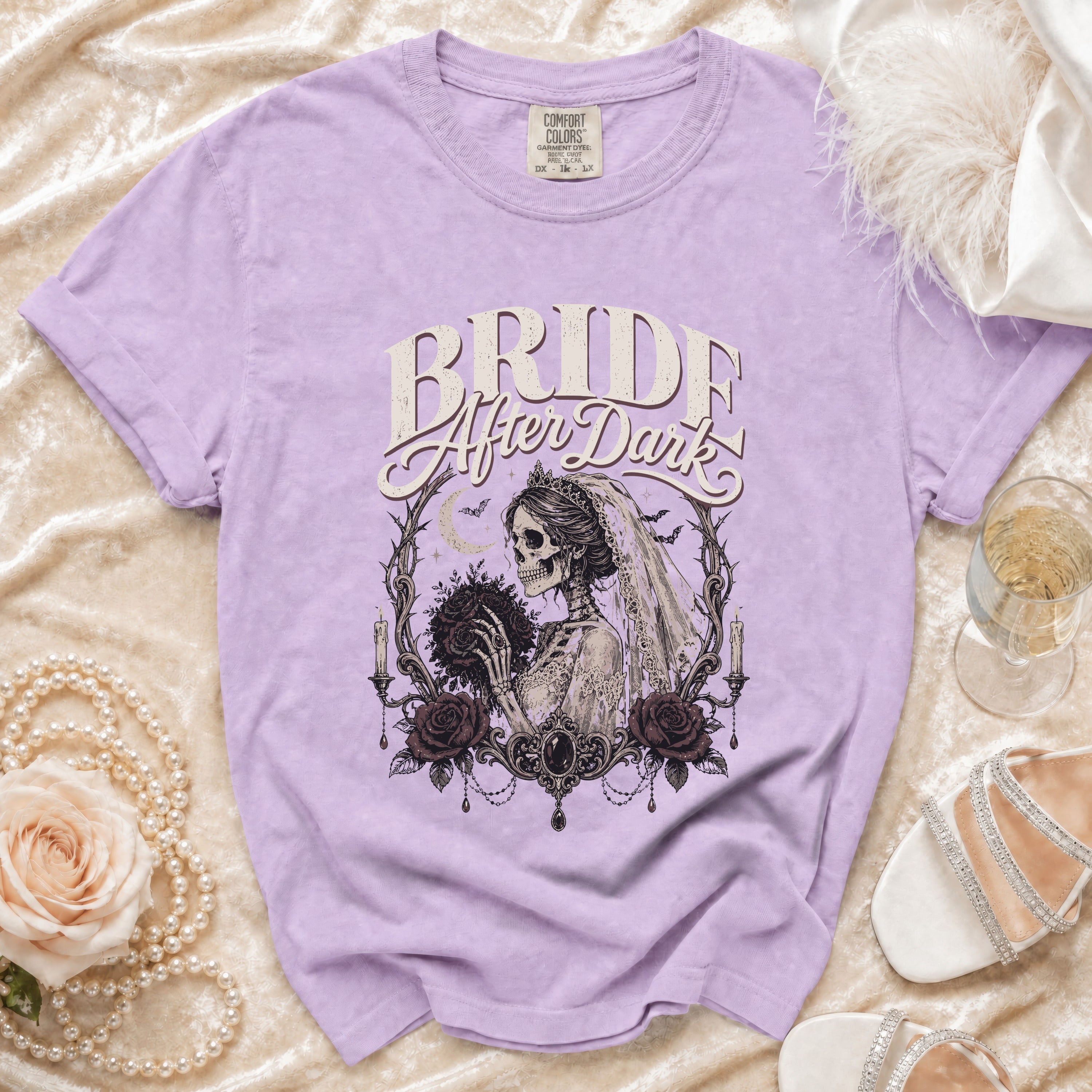 Purple t-shirt with "Bride After Dark" text and a skeleton bride with bouquet graphic.