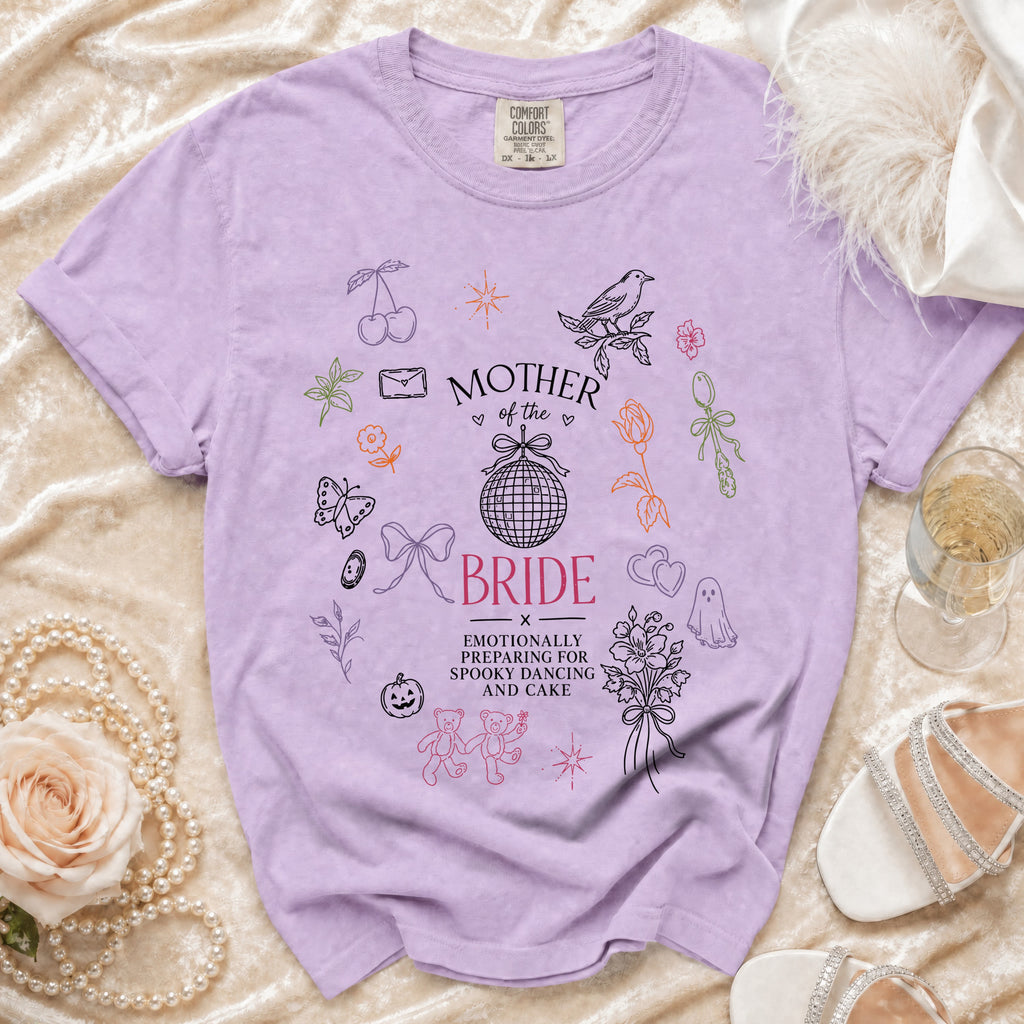 Lavender t-shirt with "Mother of the Bride" and "Emotionally preparing for spooky dancing and cake" text.