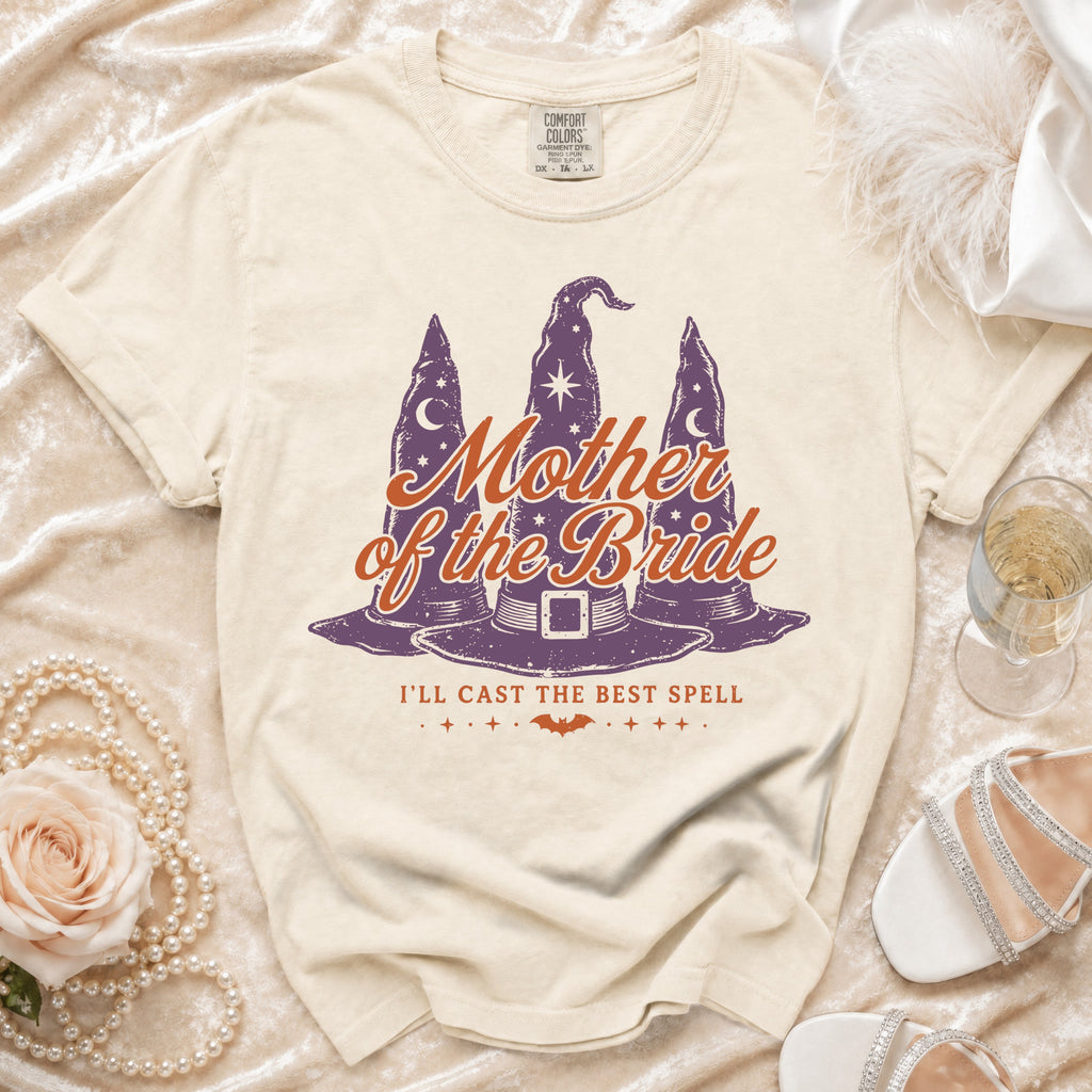 Cream t-shirt with "Mother of the Bride" and witch hats graphic.