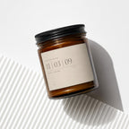 Amber jar candle with black lid, text reads "Happy Anniversary 11 03 09 Ruth + Caleb Vowed".