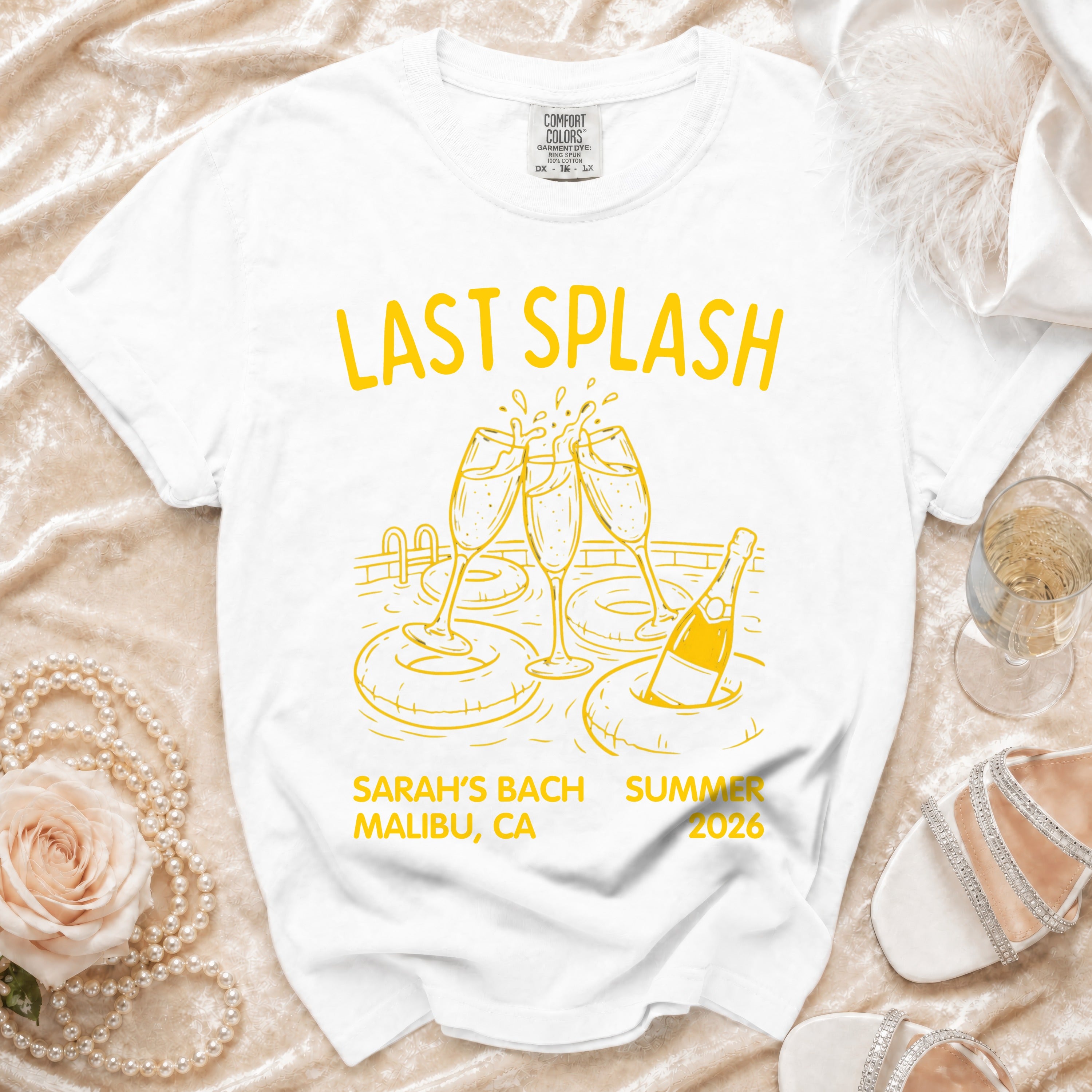 White t-shirt with "Last Splash" and bachelorette party details for Sarah's Bach Summer 2026 Malibu, CA.