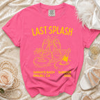 Pink t-shirt with "Last Splash" text, champagne glasses, pool floats, and bottle.