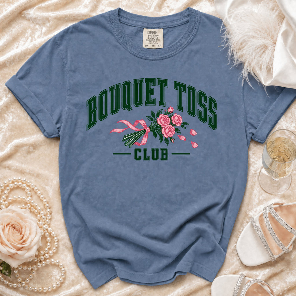 Blue t-shirt with "BOUQUET TOSS CLUB" text and pink roses graphic.