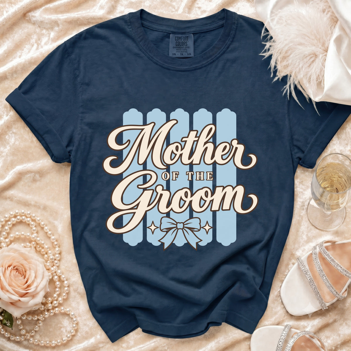 Navy Comfort Colors t-shirt with "Mother OF THE Groom" text and bow graphic.