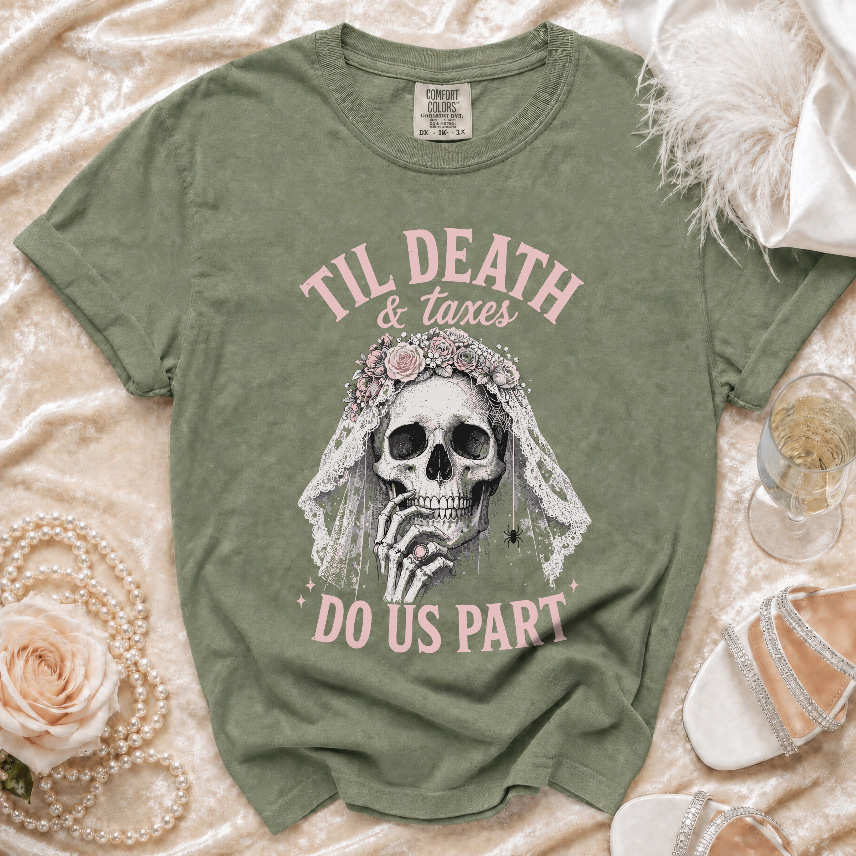 Green t-shirt with skull bride graphic and text "Til Death & Taxes Do Us Part".