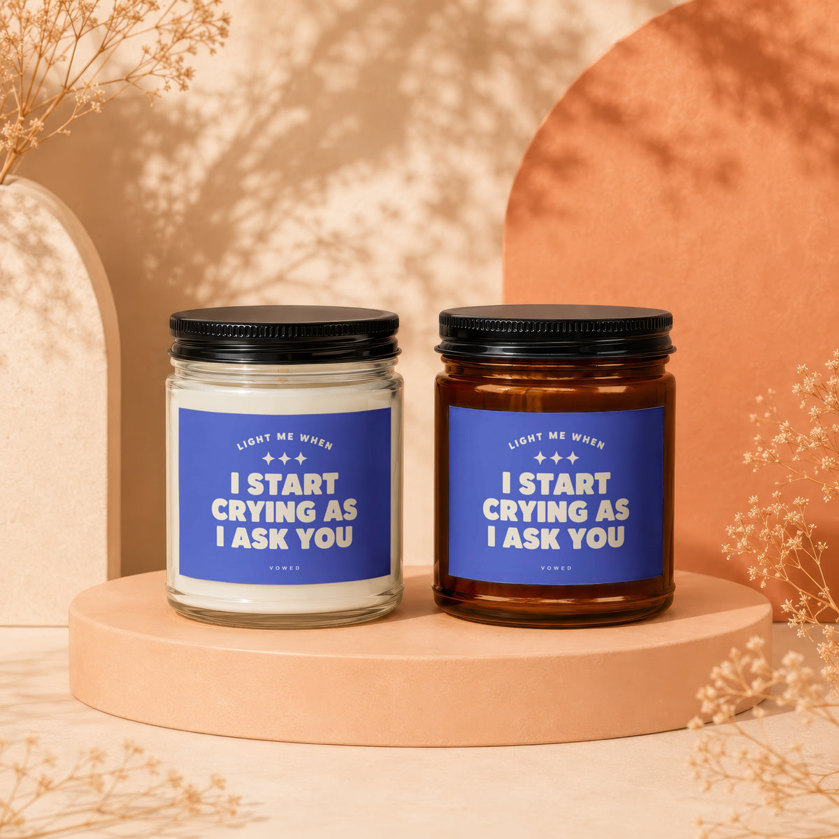 Two candles with labels reading "Light me when I start crying as I ask you."