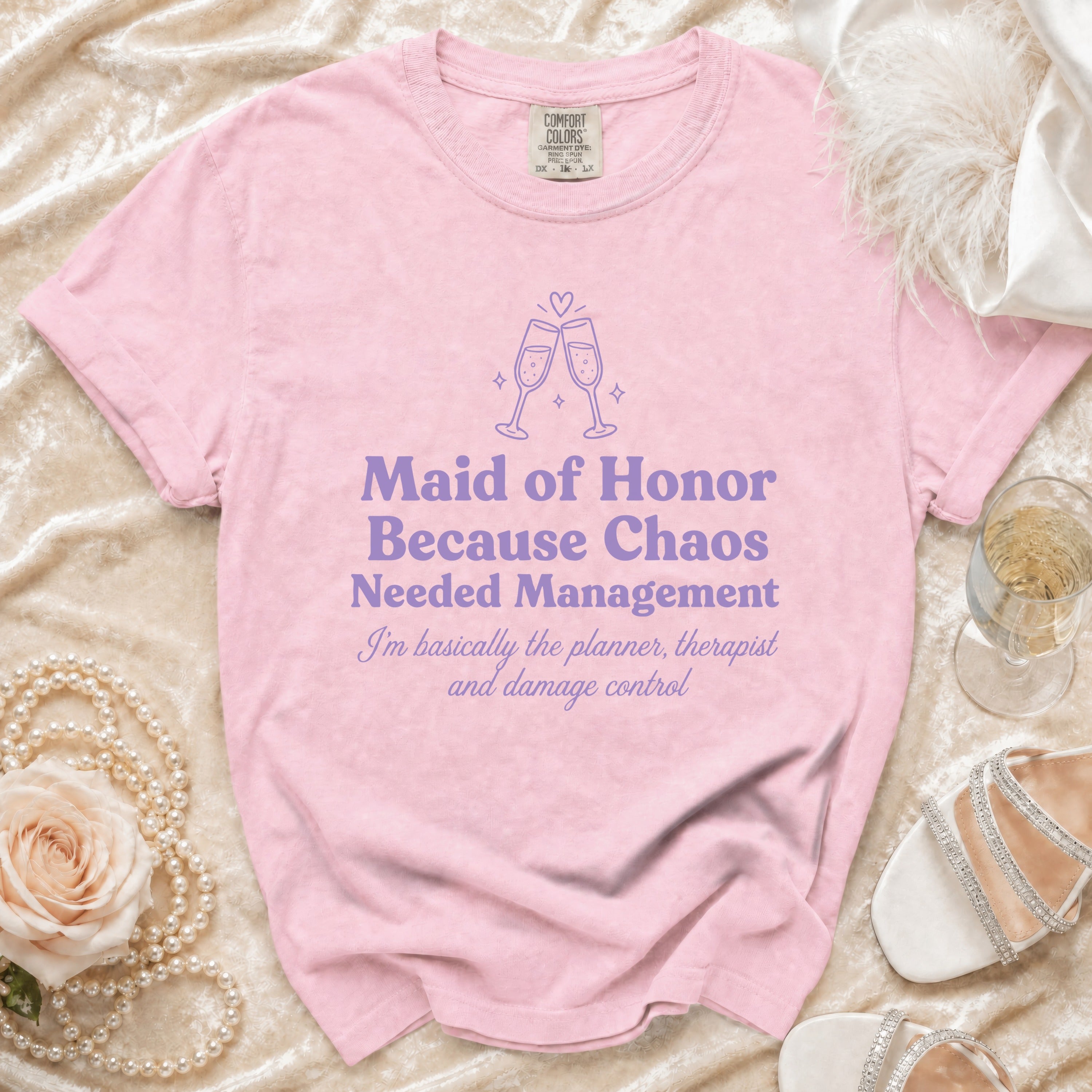 Pink t-shirt with "Maid of Honor Because Chaos Needed Management" text.