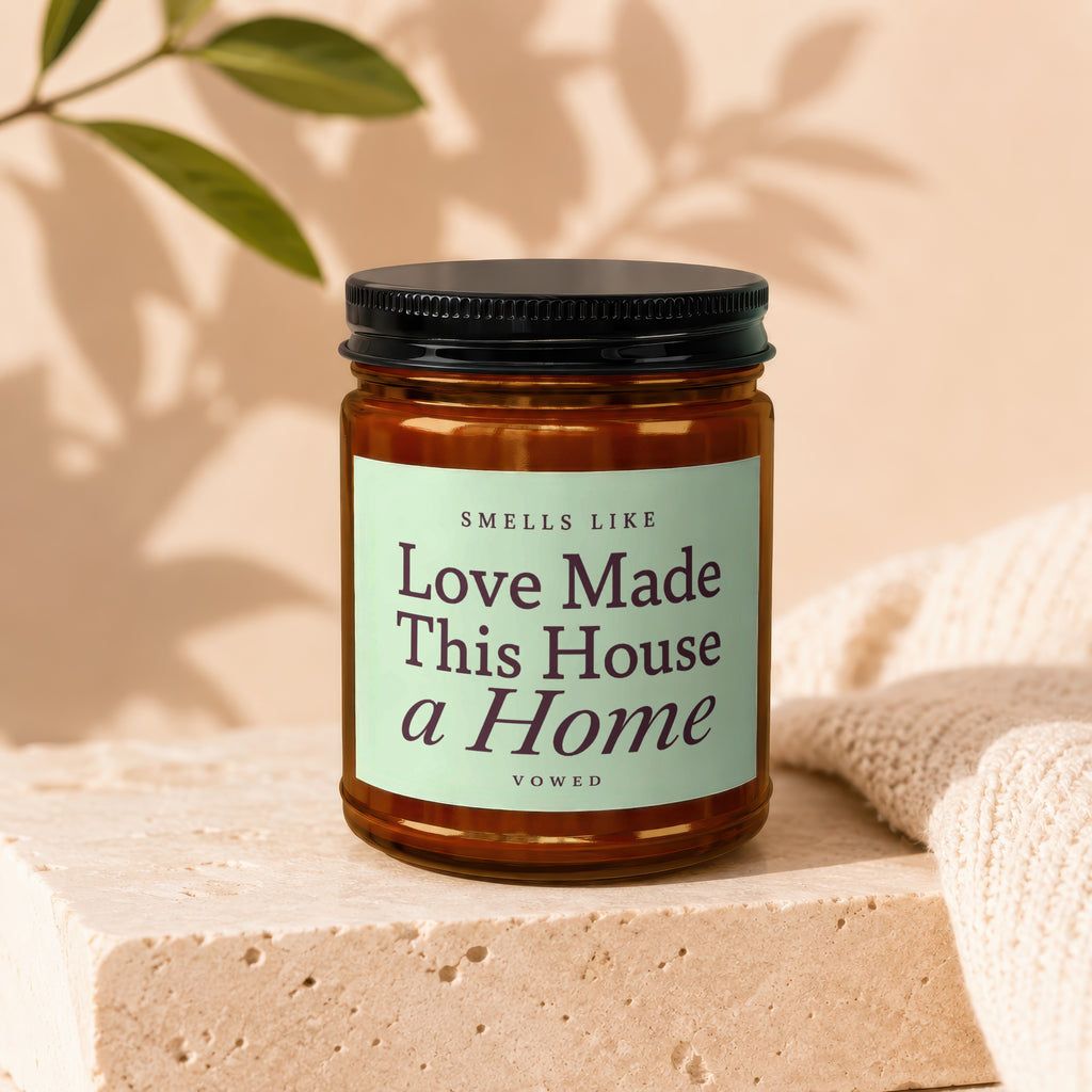 Scented candle with label "Smells Like Love Made This House a Home".