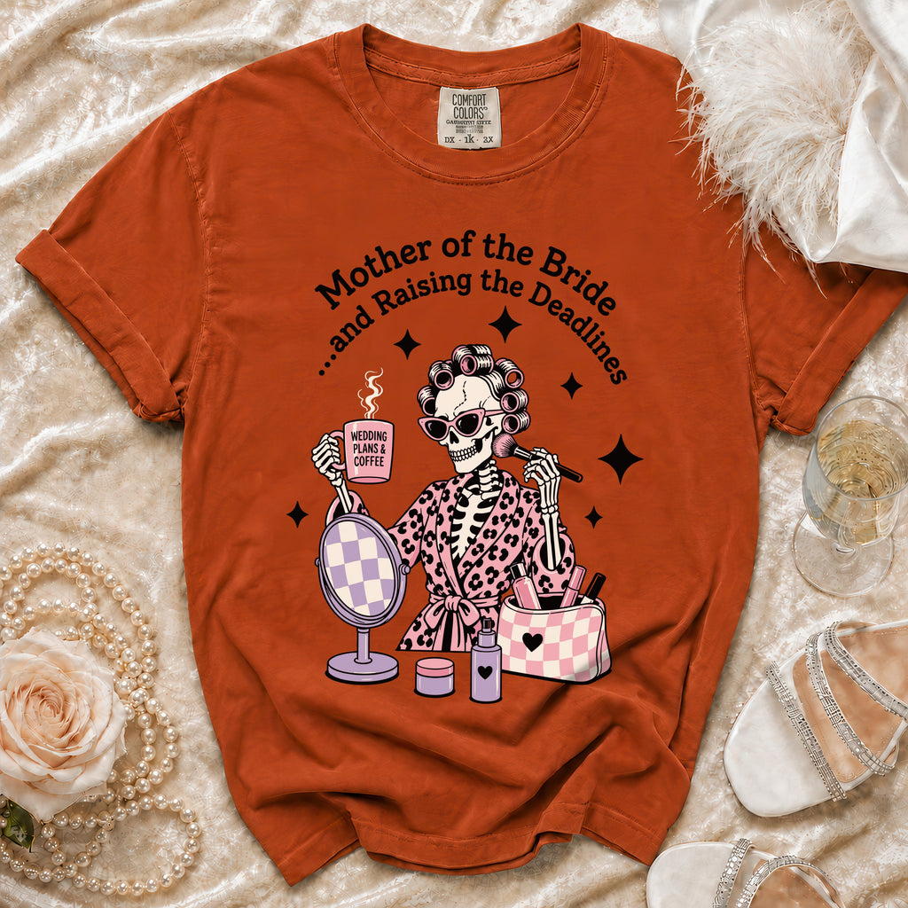 Orange t-shirt with a skeleton graphic, "Mother of the Bride... and Raising the Deadlines" text.