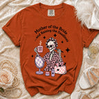 Orange t-shirt with a skeleton graphic, "Mother of the Bride... and Raising the Deadlines" text.