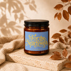 Amber candle with "For the Nearlyweds VOWED" on a blue label.