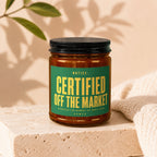 Amber jar with black lid, green label reads: Certified Off the Market.