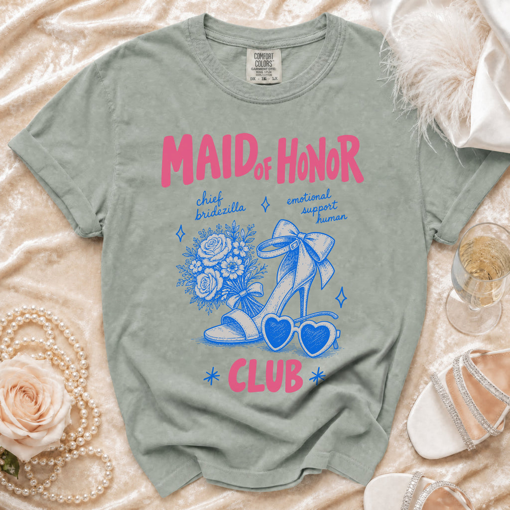 Maid of Honor Club t-shirt with pink text and blue graphics of a shoe, flowers, and heart sunglasses.
