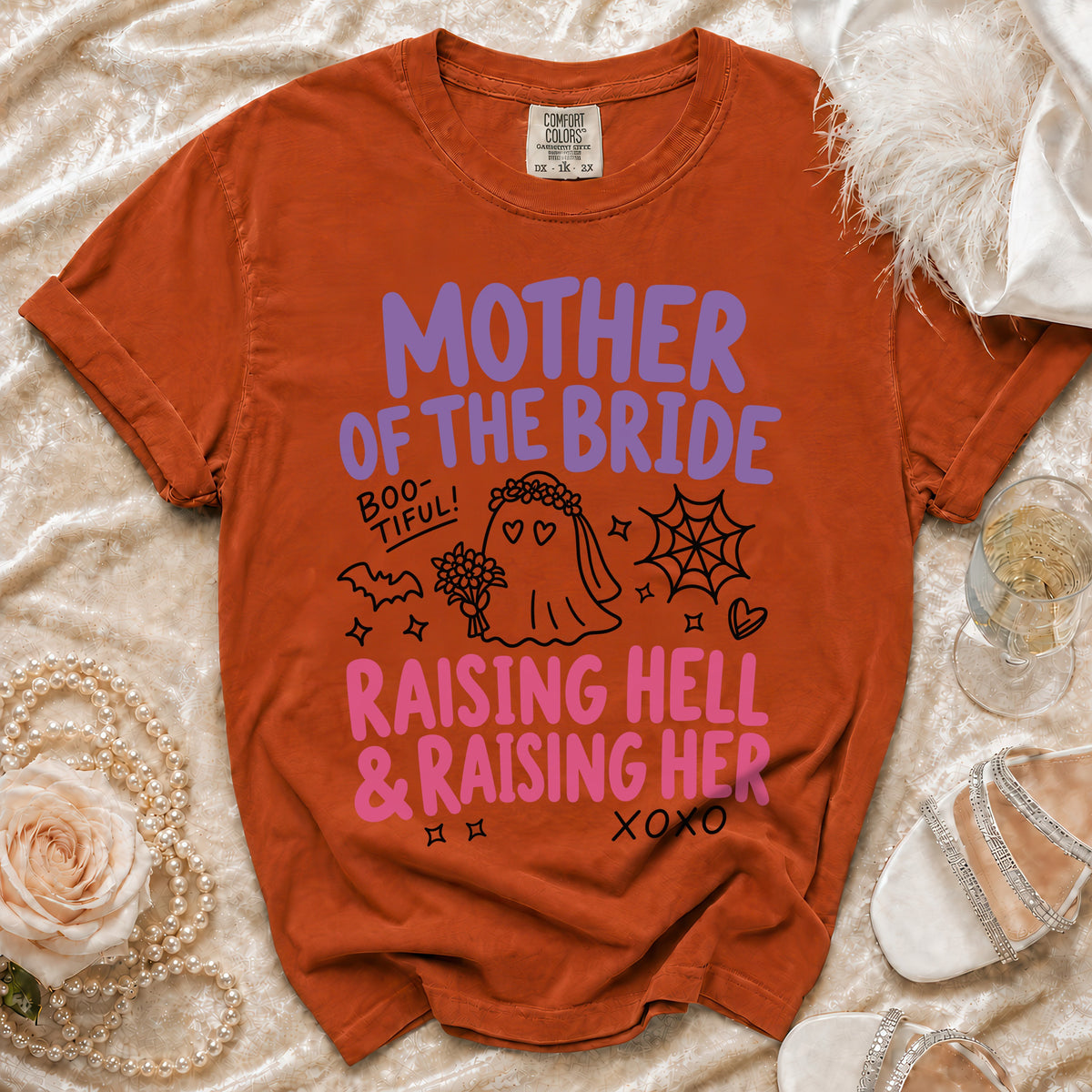 Orange t-shirt with "Mother of the Bride Raising Hell & Raising Her" text and graphics.