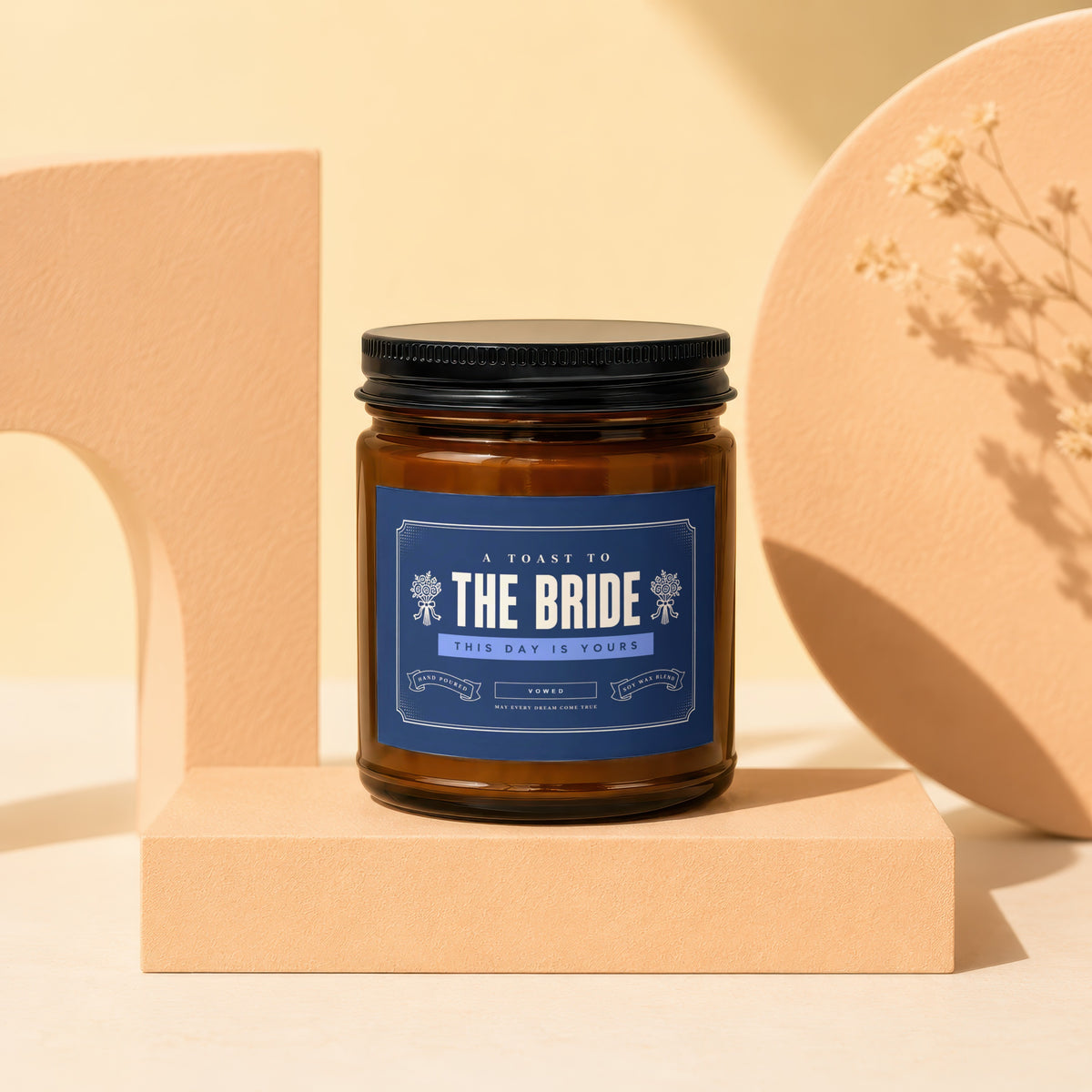 Brown candle with navy label reading "A Toast to The Bride. This Day is Yours."
