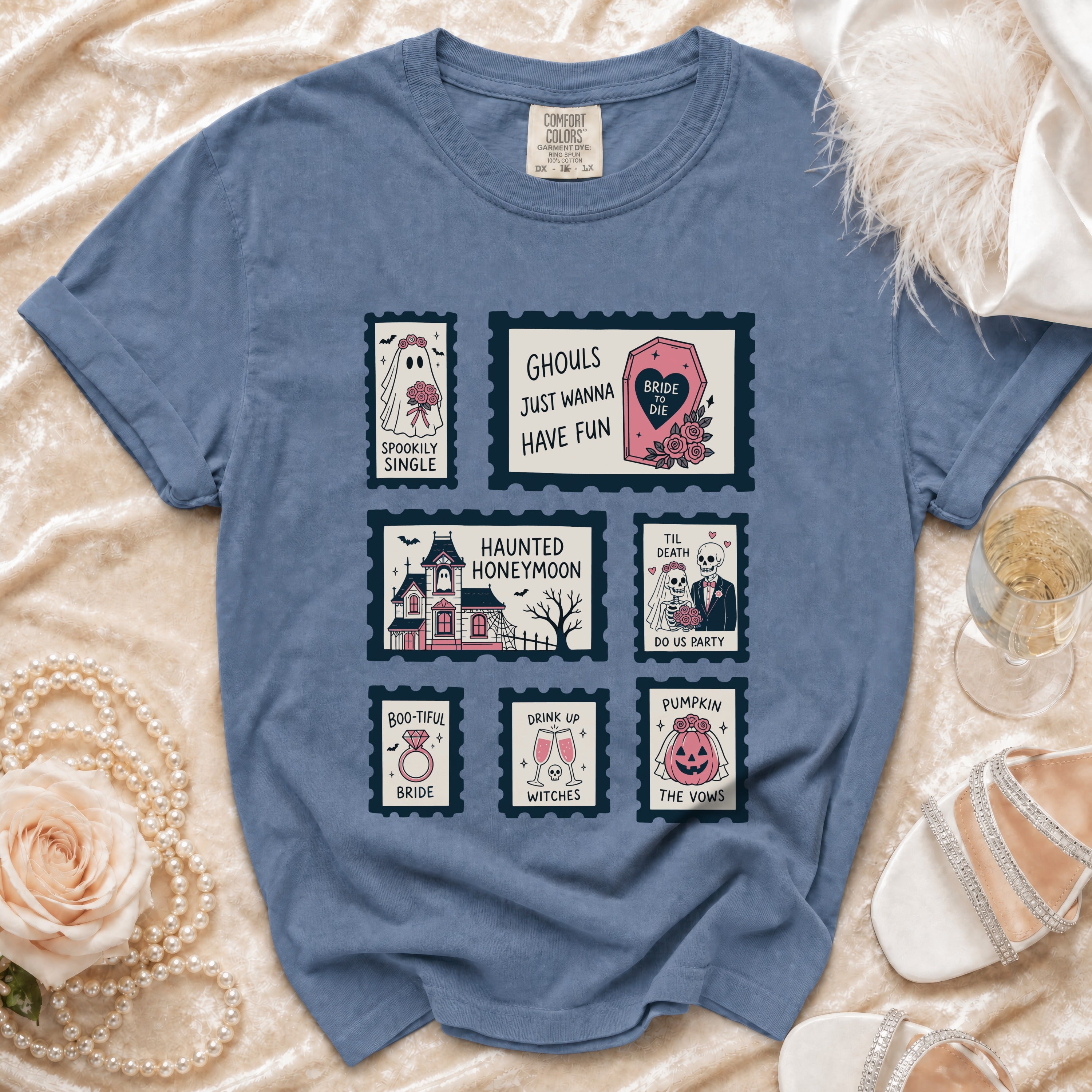 Blue t-shirt with six Halloween-themed wedding postage stamp graphics.