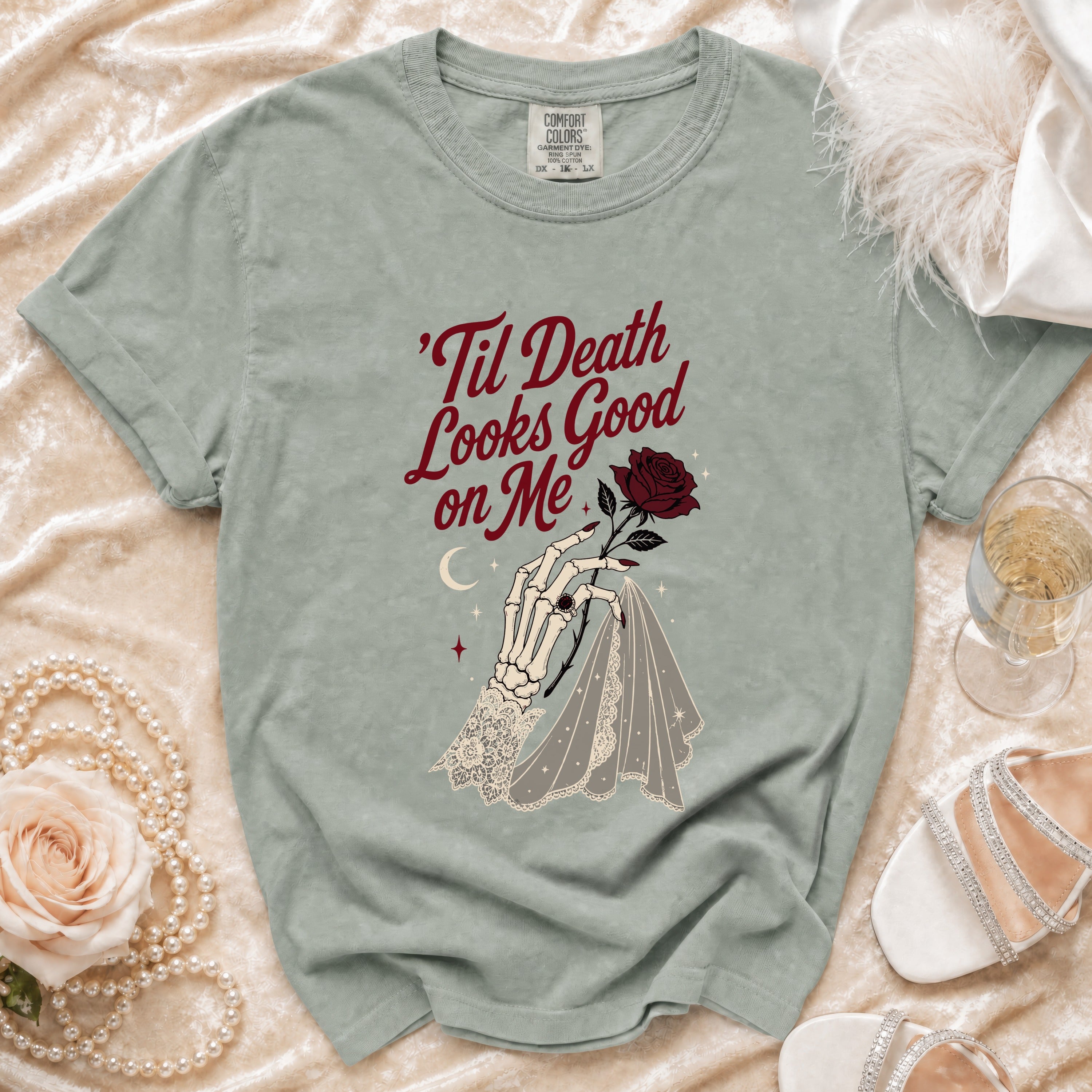 Grey t-shirt with skeleton hand, rose, and text "'Til Death Looks Good on Me".
