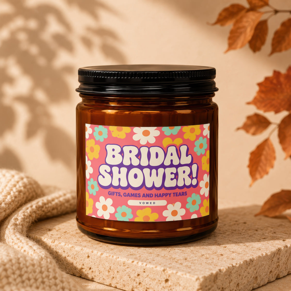 Brown jar candle with "Bridal Shower! Gifts, Games and Happy Tears" text and floral pattern.