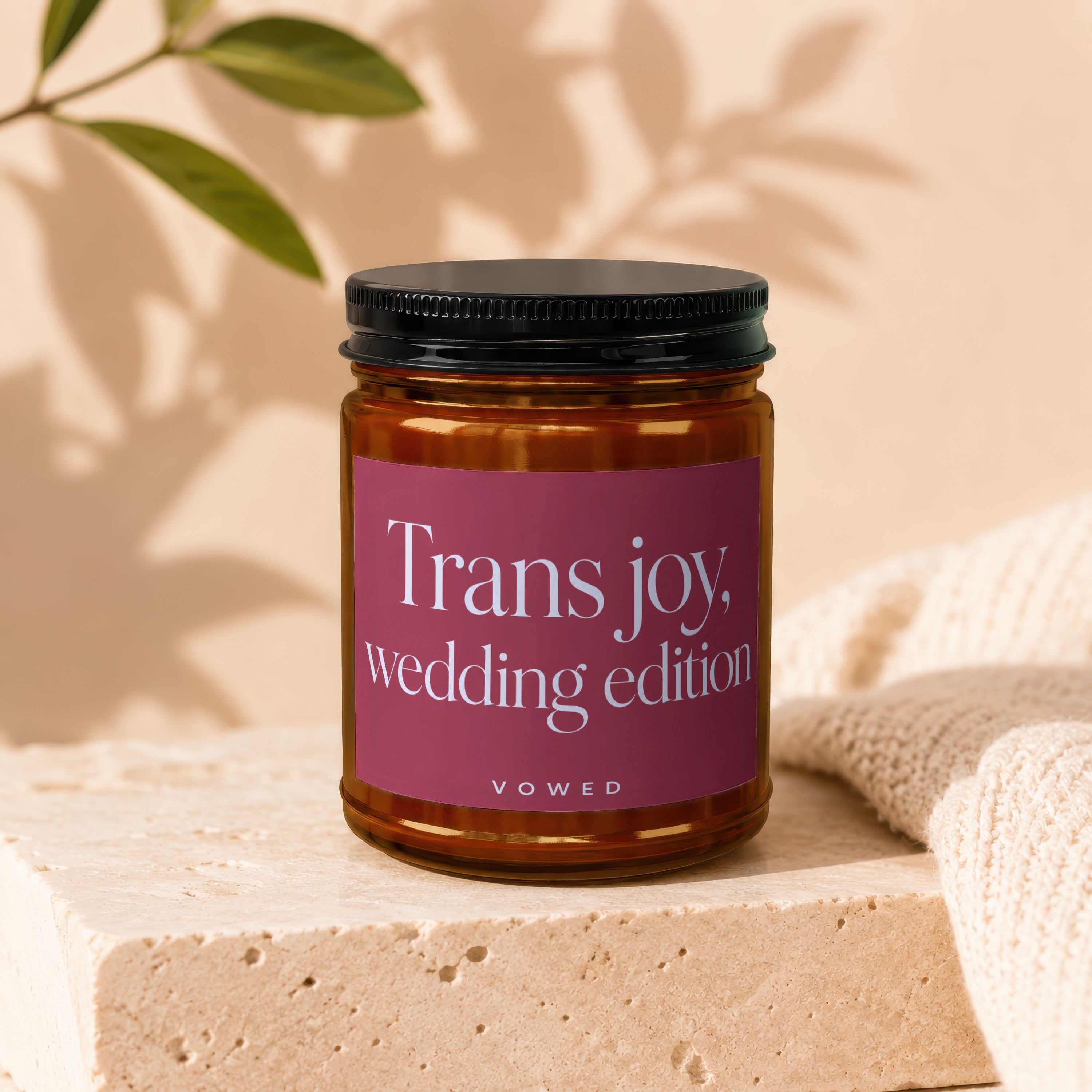 Amber jar candle labeled "Trans joy, wedding edition" by VOWED.