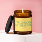 Candle with label "Two Grooms, One Great Story" on pink background.