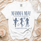 White t-shirt with "Mamma Mia! I'm Getting Married! Nashville 2026" and dancing silhouettes.