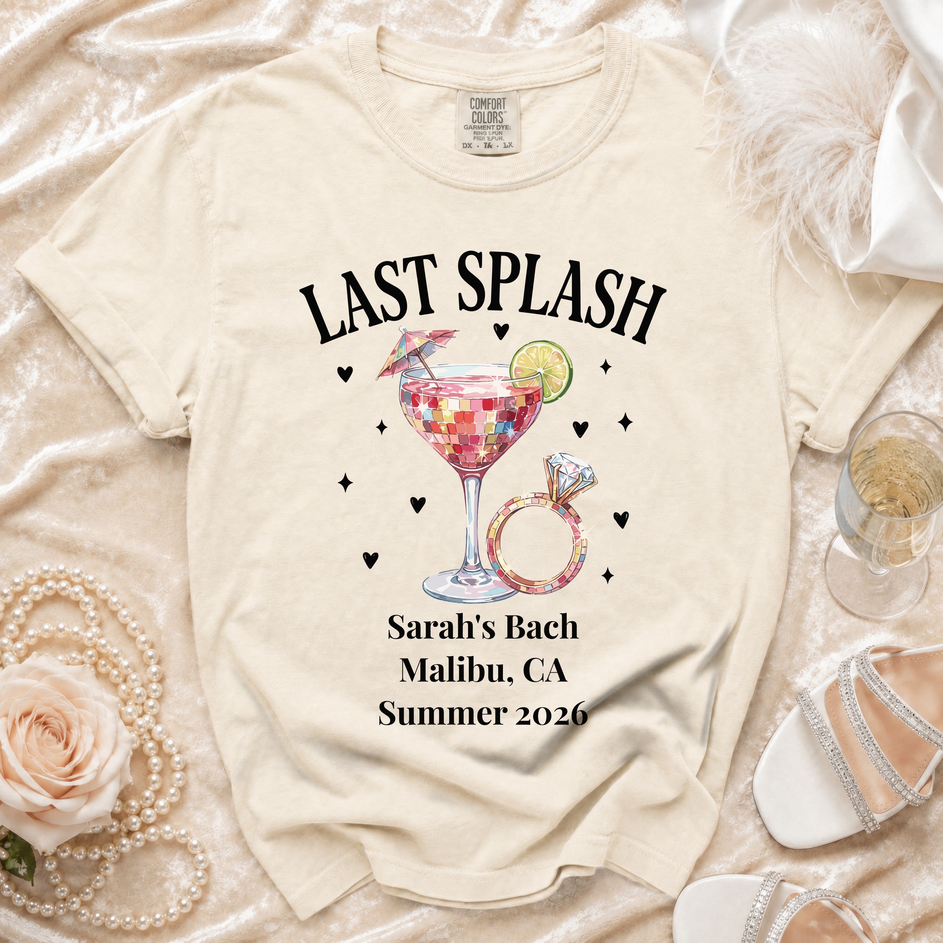 Cream t-shirt with "Last Splash" and ring for Sarah's Bach in Malibu, Summer 2026.